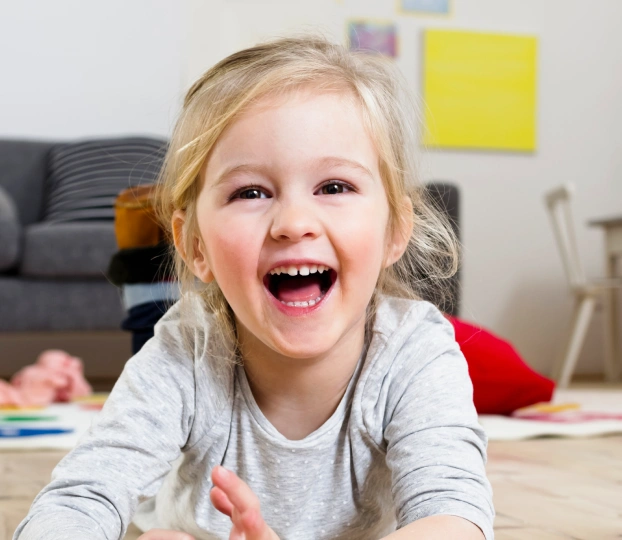 Happy child smiling during airway dentistry consultation at Aurora dental practice in Illinois.
