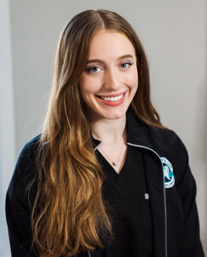 Anabelle, dental hygienist at Aurora dental office in Aurora, IL welcoming patients.