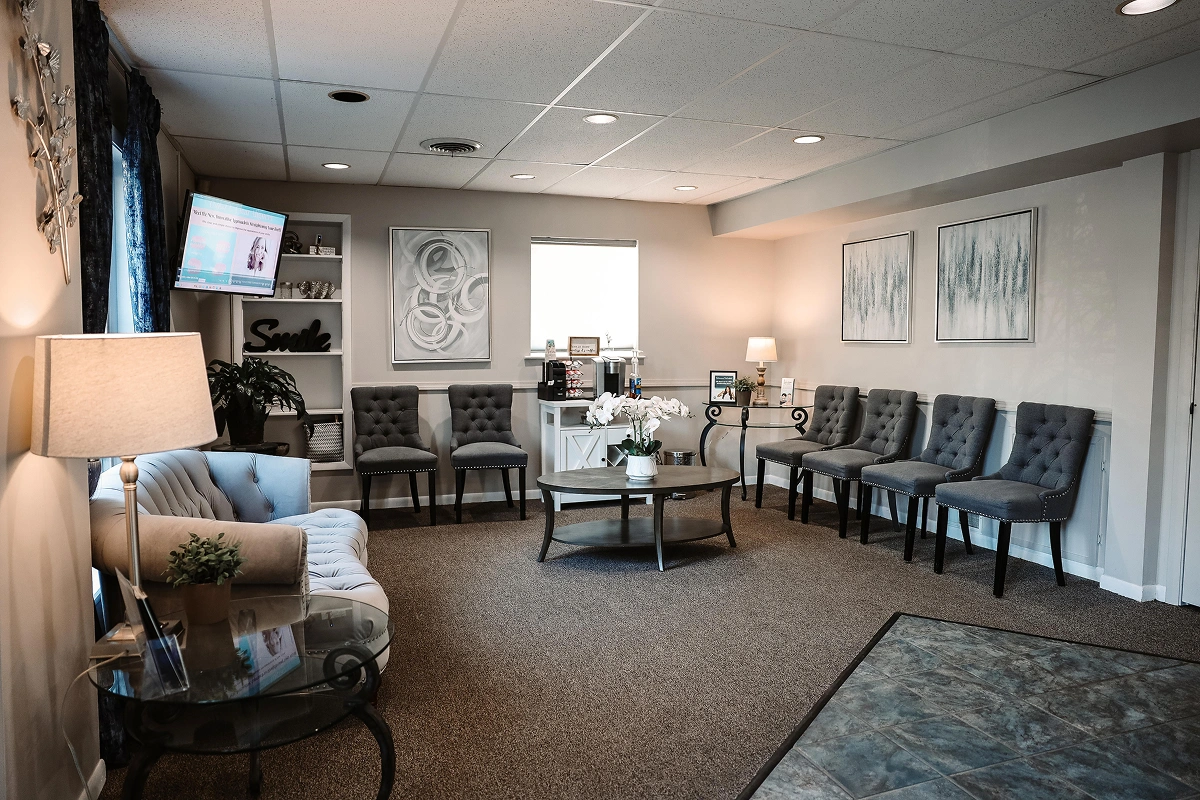 Welcoming waiting area at dental practice in Aurora, IL with comfortable seating and modern decor.