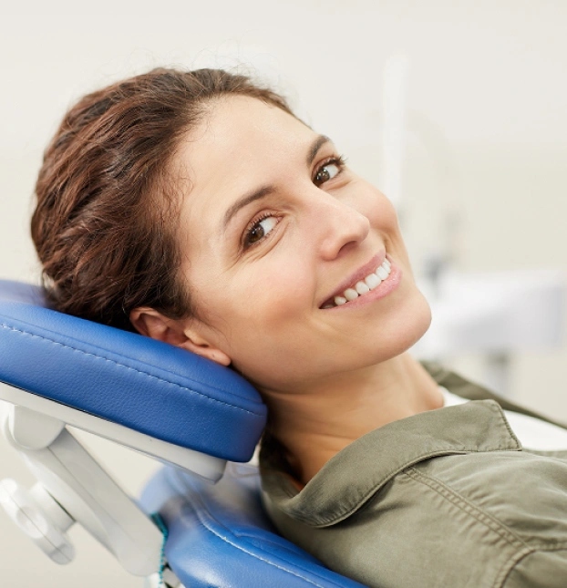 Happy patient smiling after dental cleaning and exam at Aurora dental office in Illinois.