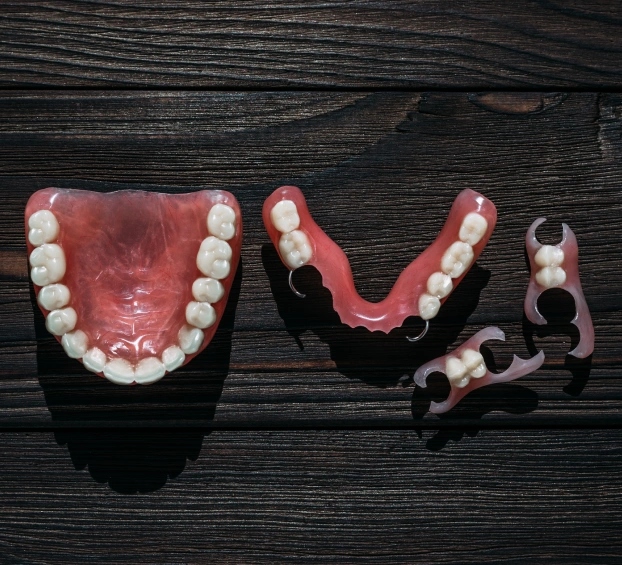 Full dentures and partial dentures displayed at Aurora dental practice on Prairie Street.
