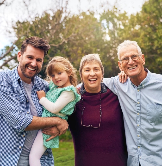 Happy multigenerational family at dental office in Aurora, IL.