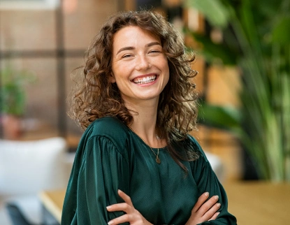 Smiling patient after cosmetic dentistry at Aurora, IL dental office.