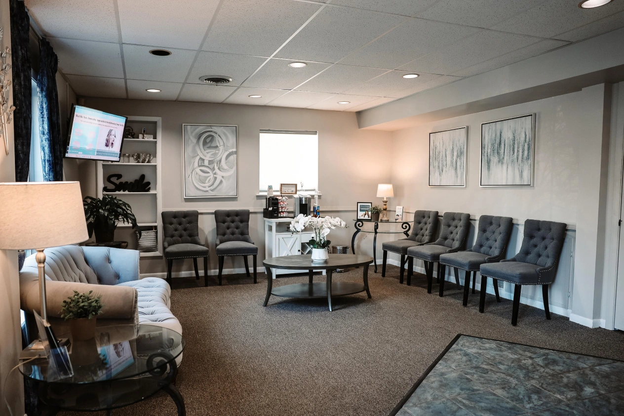 Welcoming waiting area at dental practice in Aurora, IL with comfortable seating.