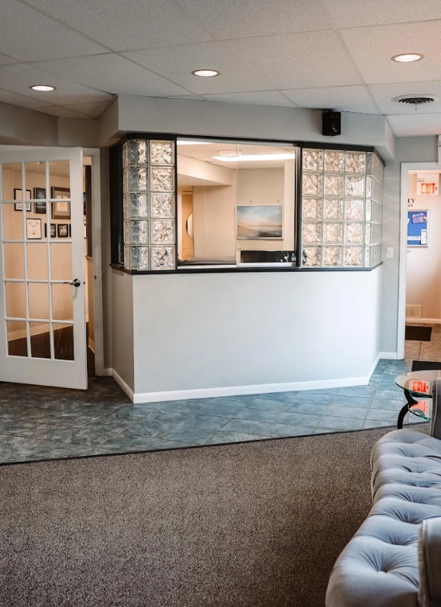 Modern reception and check-in area at dental practice in Aurora, Illinois welcoming patients.