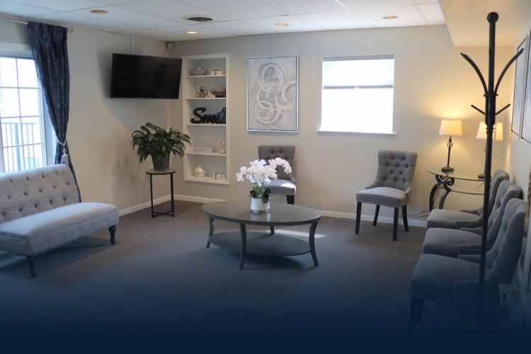 Welcoming waiting area at dental practice in Aurora, IL with comfortable seating and modern décor.