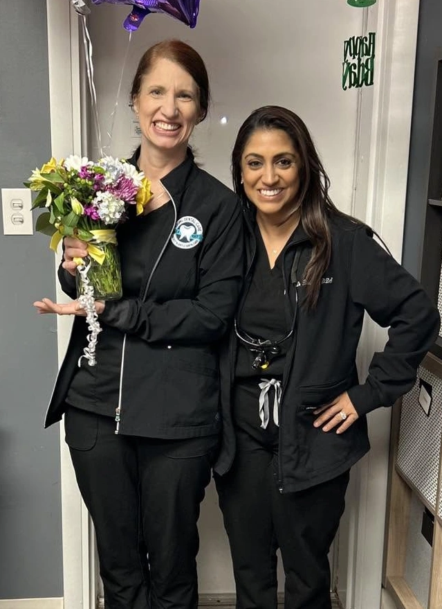 Dental hygienist and dentist team at dental practice in Aurora, Illinois.